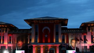 Supporters of the President Recep Tayyip Erdogan gather outside the Presidential Palace in Ankara, Turkey, Sunday, May 28, 2023.