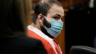 FILE – Ahmad Al Aliwi Alissa listens during a hearing in Boulder, Colo., Sept. 7, 2021.