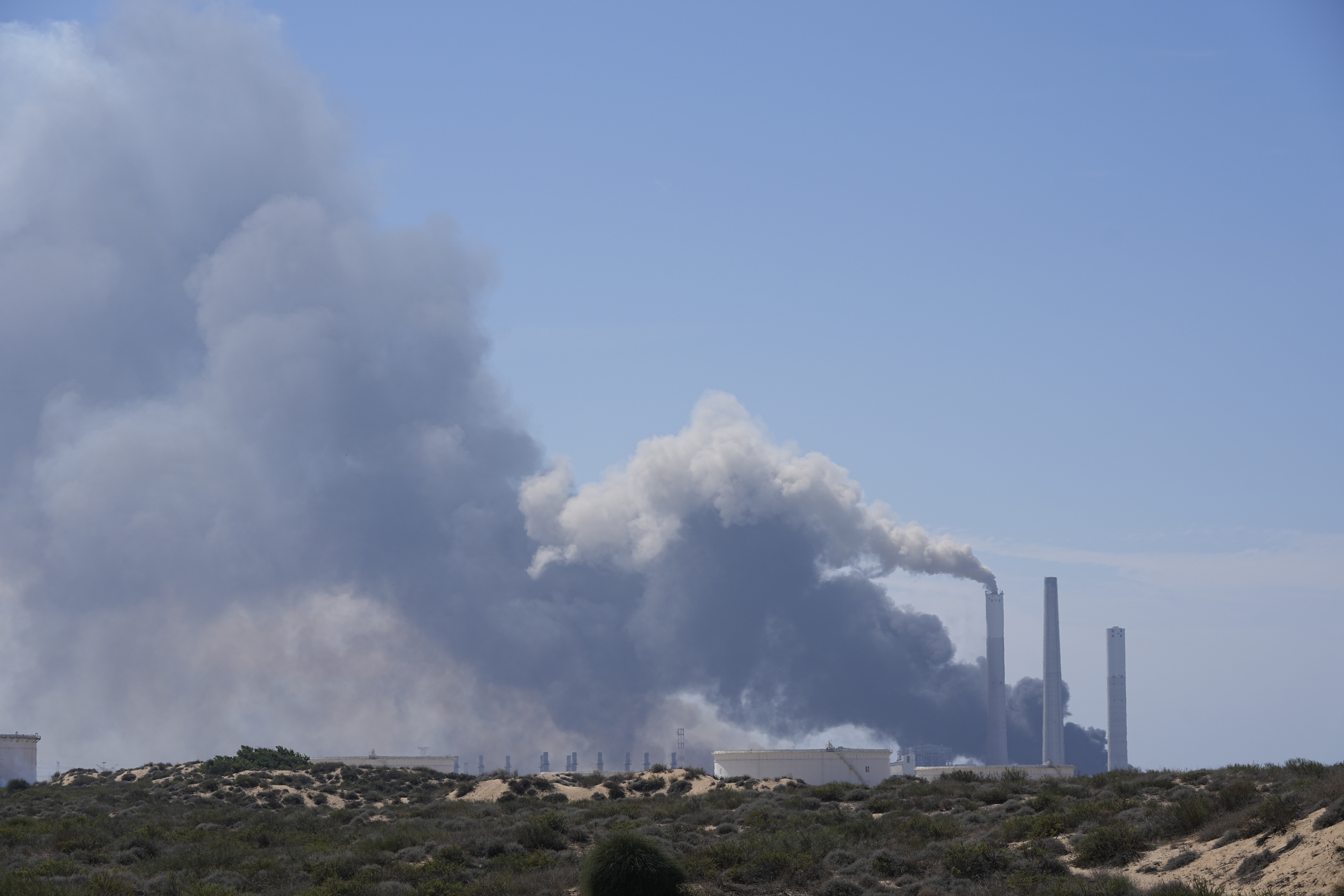 Smoke rises from an area near a power plant outside Ashkelon, Israel, on Saturday, Oct. 7, 2023.