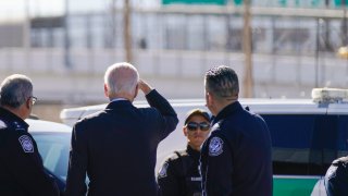 President Joe Biden looks towards a large “Welcome to Mexico” sign that is hung over the Bridge of the Americas in El Paso Texas, Sunday, Jan. 8, 2023.