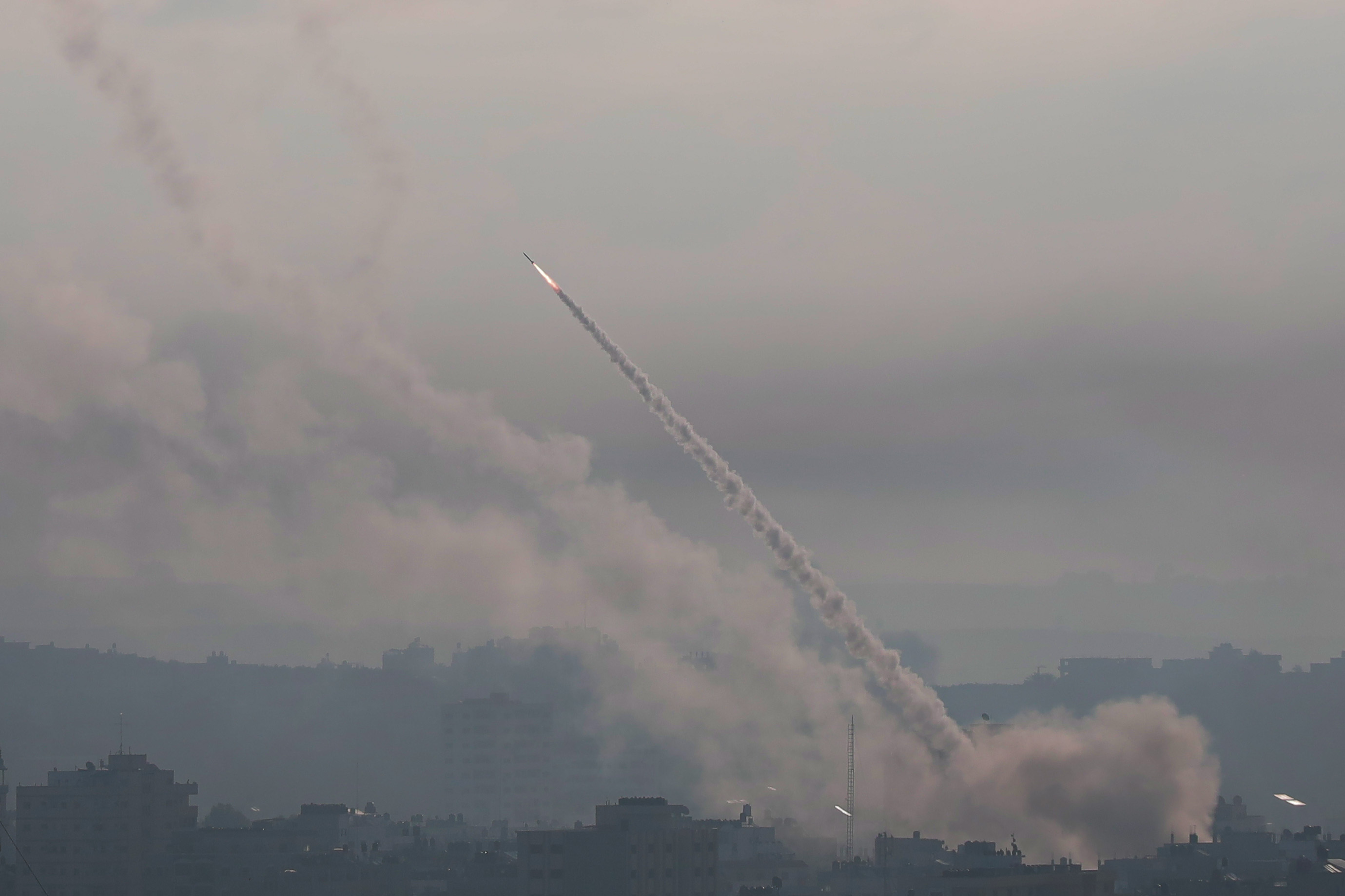 Palestinian militants fire missiles at Israel in Gaza on October 7, 2023.