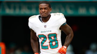 MIAMI GARDENS, FLORIDA – OCTOBER 8: De’Von Achane #28 of the Miami Dolphins runs out of the tunnel during player introductions prior to a game against the New York Giants at Hard Rock Stadium on October 8, 2023 in Miami Gardens, Florida. (Photo by Brandon Sloter/Image Of Sport/Getty Images)