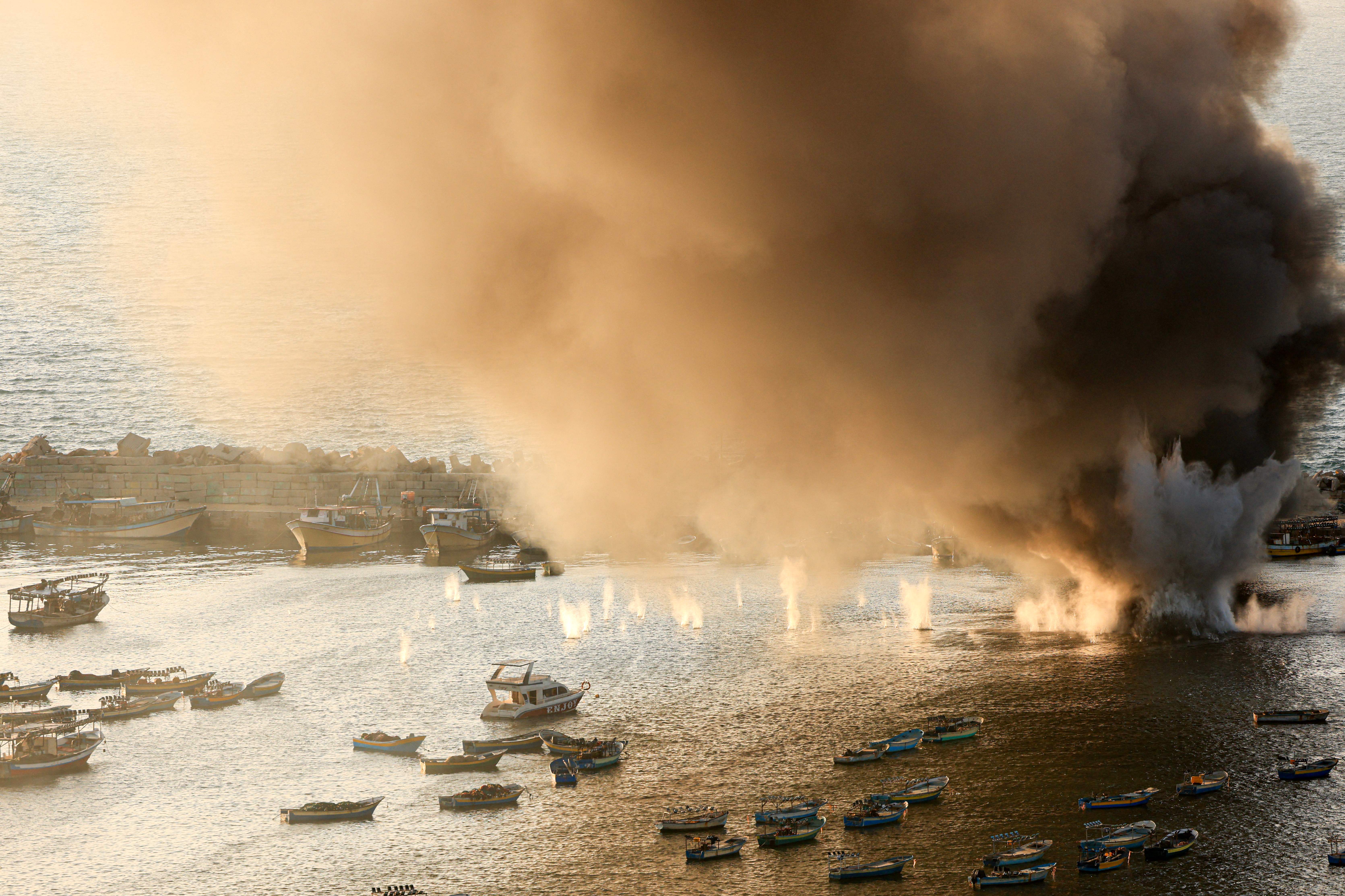Smoke billows after a strike by Israel on the port of Gaza City on Oct. 10, 2023.