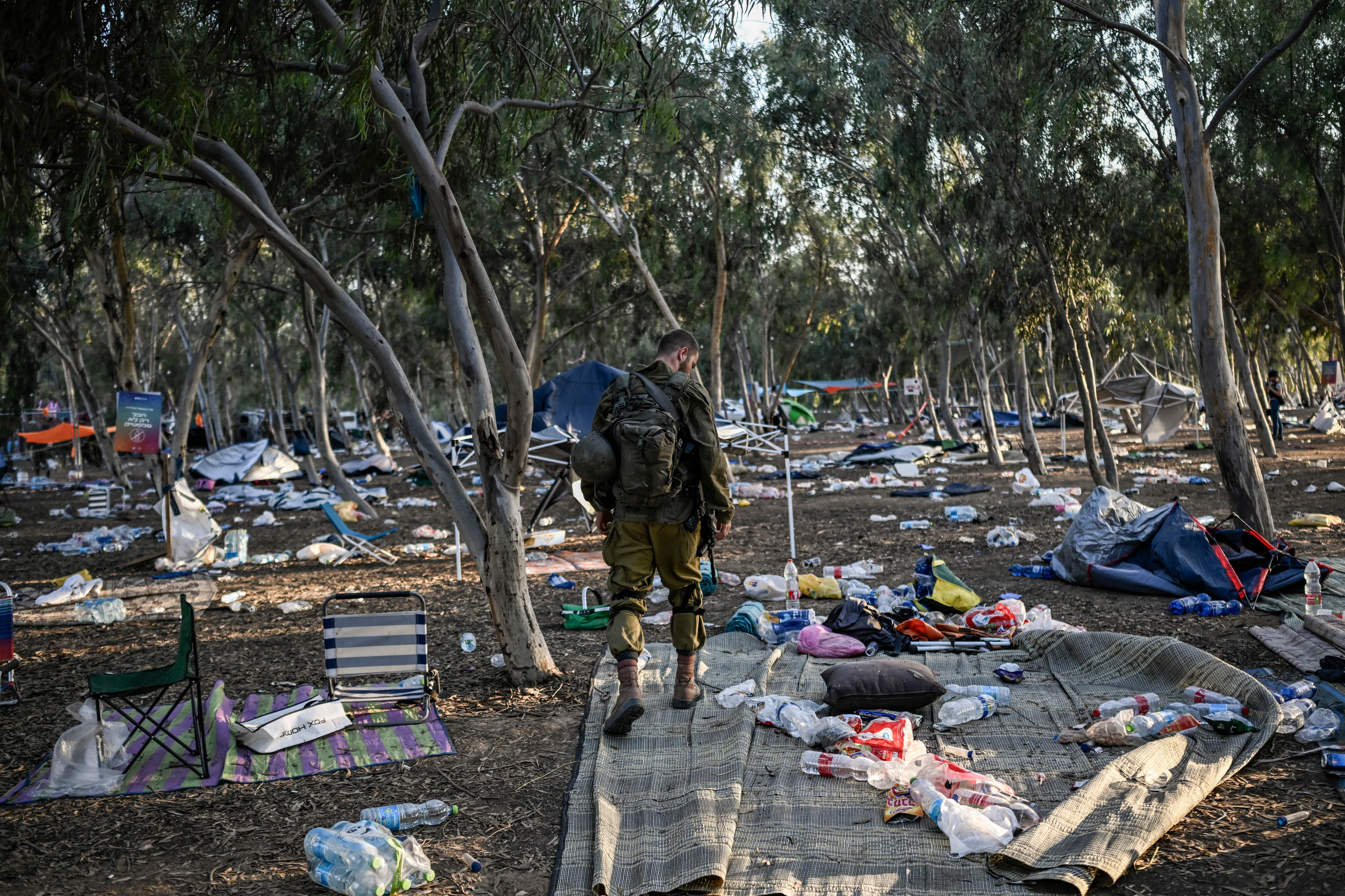 An Israeli soldier patrols near Kibbutz Beeri in southern Israel on Oct. 12, 2023, close to the place where 270 revellers were killed by militants during the Supernova music festival on Oct. 7.