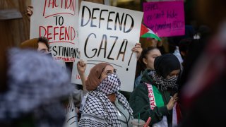 NEW YORK, UNITED STATES – 2023/10/12: Students from Hunter College chant and hold up signs during a pro-Palestinian demonstration at the entrance of their campus. The pro-Palestinian student organization Students for Justice In Palestine (SJP) held protests in colleges across the nation to show solidarity with Palestine. On October 7 the Palestinian militant group Hamas launched a large-scale surprise attack from Gaza, launching thousands of missiles and sending at least 1,500 fighters by land, sea and air into Israel. At least 1,300 Israelis have been confirmed killed and 150 kidnapped. 1,203 Palestinians in Gaza are also confirmed killed. The attack is prompting retaliatory strikes by Israel on Gaza and a declaration of war by the Israeli prime minister. (Photo by Michael Nigro/Pacific Press/LightRocket via Getty Images)