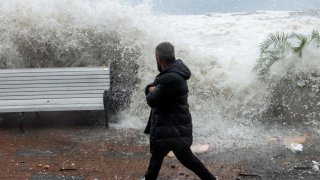 Waves crash against a seafront in the Black Sea resort city of Sochi during a storm on November 27, 2023. (Photo by Mikhail Mordasov / AFP) (Photo by MIKHAIL MORDASOV/AFP via Getty Images)
