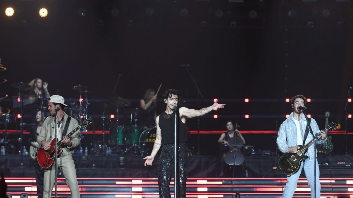 Joe Jonas officiates marriage ceremony on stage for the duration of Jonas Brothers live performance