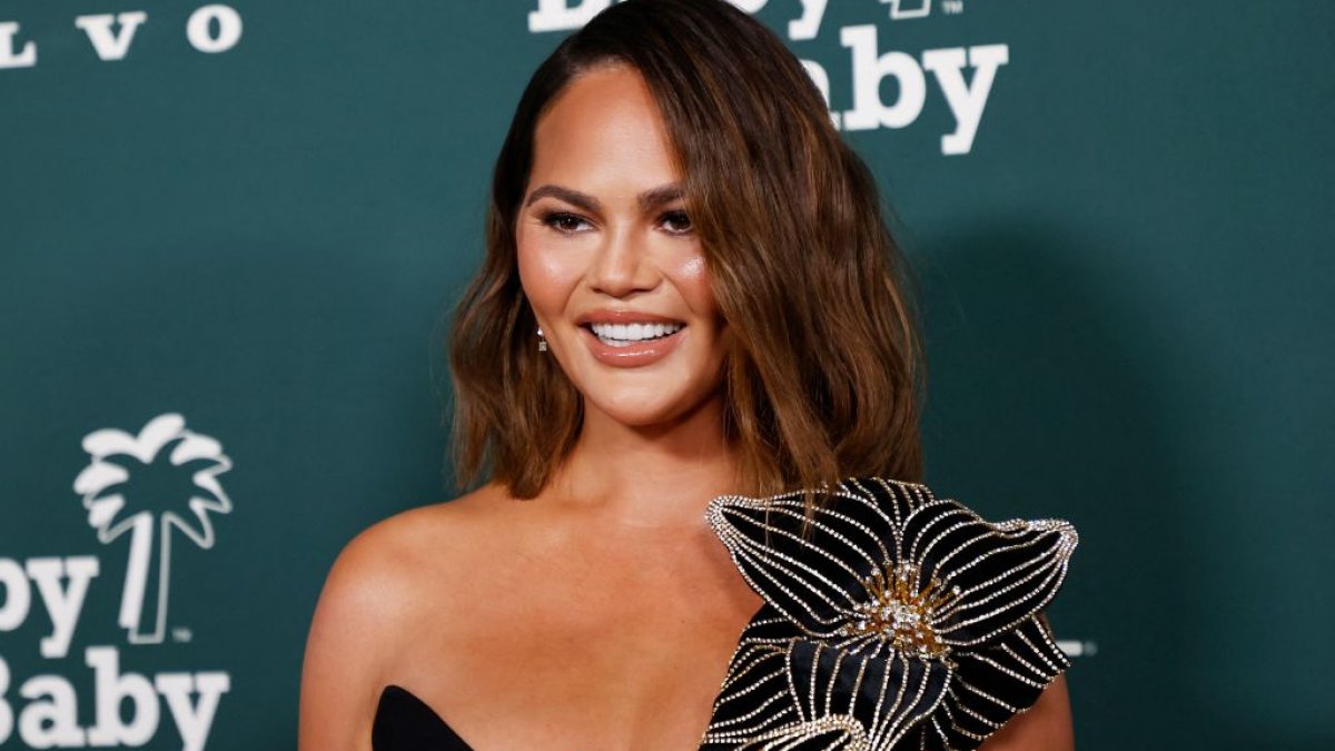 Chrissy Teigen laughs off wardrobe malfunction at Baby2Infant Gala 2023