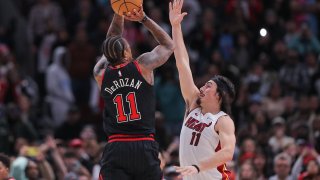 CHICAGO, IL – NOVEMBER 18: DeMar DeRozan #11 of the Chicago Bulls shoots a 3-point basket over Jaime Jaquez Jr. #11 of the Miami Heat during the second half at the United Center on November 18, 2023 in Chicago, Illinois.