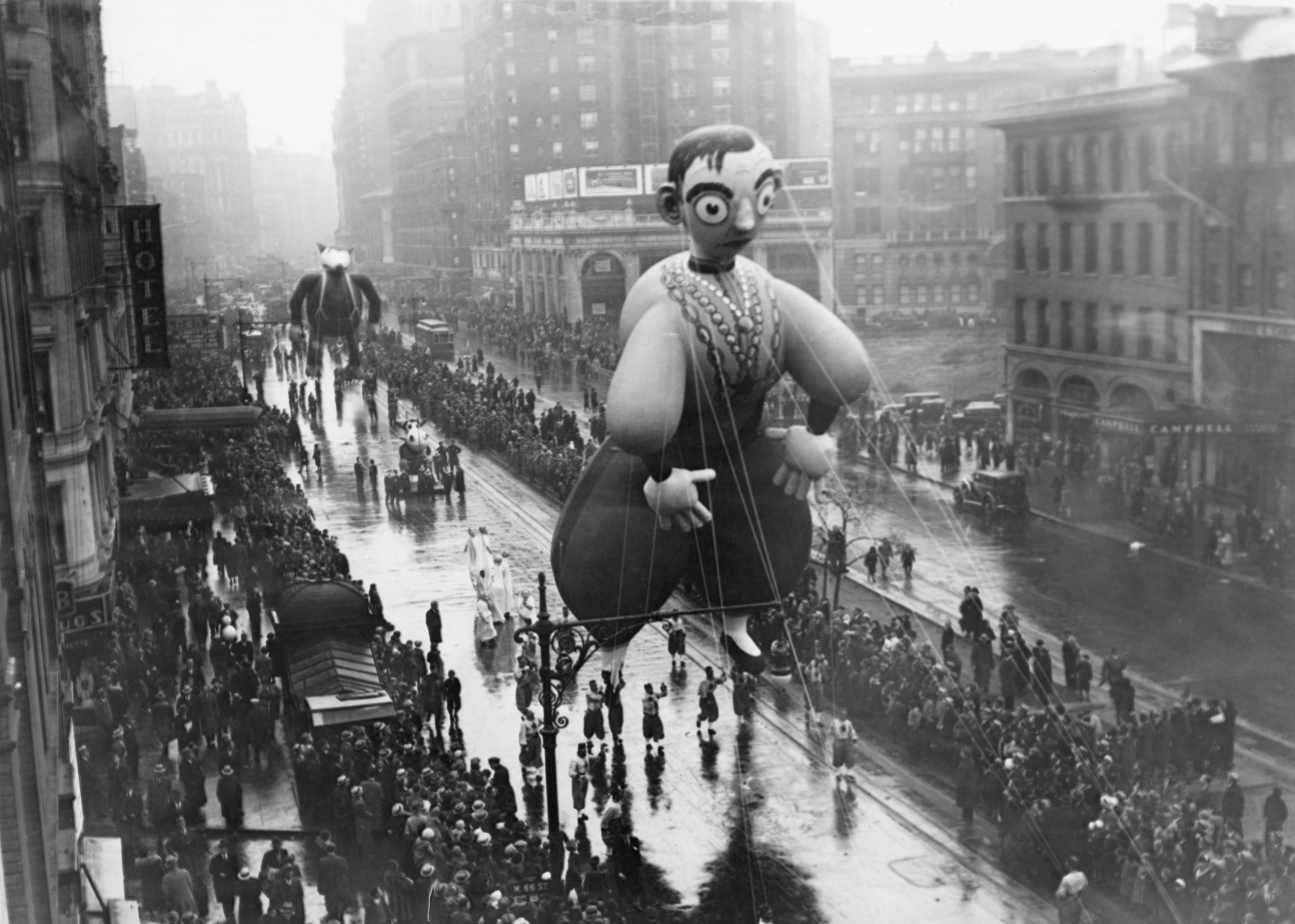 A giant Eddie Cantor balloon, followed by the Big Bad Wolf, in Macy’s Thanksgiving Day Parade, New York City, 22nd November 1934. (Photo by FPG/Archive Photos/Getty Images)