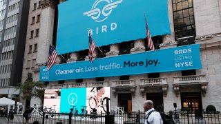 A banner for electric scooter rental company Bird is displayed outside of the New York Stock Exchange as the company goes public via a SPAC on Nov. 5, 2021.