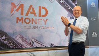 Jim Cramer at the NYSE with Mad Money graphic, June 30, 2022.
