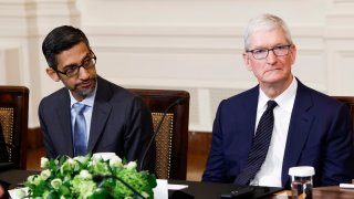 File - Google CEO Sundar Pichai (L) and Apple CEO Tim Cook (R) listen as President Joe Biden speaks during a roundtable with American and Indian business leaders in the East Room of the White House in Washington, D.C., on June 23, 2023.