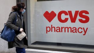 A person walks by a CVS pharmacy store in Manhattan, New York, U.S., November 15, 2021.