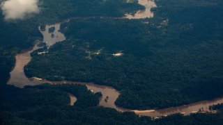 TOPSHOT – Aerial view of the Essequibo region taken from Guyana on December 12, 2023. Venezuelan President Nicolas Maduro and his Guyanese counterpart, Irfaan Ali, will meet on December 14, 2023 in Saint Vincent and the Grenadines, on their countries’ growing dispute over the oil-rich region of Essequibo, amid mounting international warnings against escalating the row. (Photo by Roberto CISNEROS / AFP) (Photo by ROBERTO CISNEROS/AFP via Getty Images)