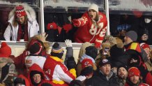 KANSAS CITY, MISSOURI - JANUARY 13: Taylor Swift celebrates with fans during the AFC Wild Card Playoffs between the Miami Dolphins and the Kansas City Chiefs at GEHA Field at Arrowhead Stadium on January 13, 2024 in Kansas City, Missouri. (Photo by Jamie Squire/Getty Images)