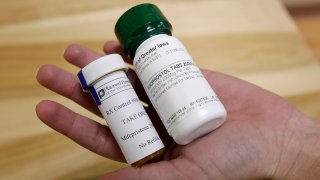 FILE - Bottles of abortion pills mifepristone, left, and misoprostol, right, are shown, Sept. 22, 2010, at a clinic in Des Moines, Iowa.