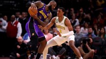 Apr 2, 2023; Houston, Texas, USA; Los Angeles Lakers forward LeBron James (6) handles the ball against Houston Rockets forward Jabari Smith Jr. (1) during the first quarter at Toyota Center. Mandatory Credit: Erik Williams-USA TODAY Sports