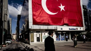 Turkish flag over a DenizBank building. Turkey is expected to head to the polls on Sunday.