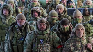 Volunteers, who joined the Russian armed forces and took military training in Chechnya, board a plane before departing for positions of the Akhmat battalion involved in Russia’s military campaign in Ukraine, at an airport in Grozny, Russia, January 17, 2024. 