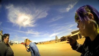 In this screen grab from lapel camera video provided by the Santa Fe County Sheriff’s Office, movie set armorer Hannah Gutierrez-Reed, right, speaks with a sheriff’s deputy as other colleagues, at center and left, react on the set of the western move “Rust,” shortly after the fatal shooting of cinematographer Halyna Hutchins by Alec Baldwin during a rehearsal, Oct. 21, 2021, in New Mexico.