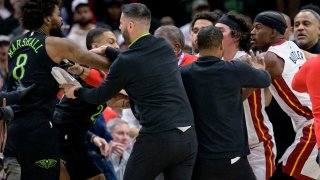 New Orleans Pelicans forward Naji Marshall (8), left, and Miami Heat forward Jimmy Butler, right, get into a scuffle