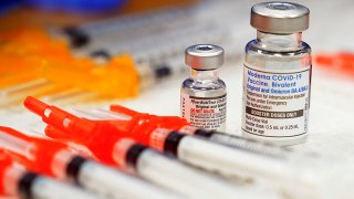 FILE - COVID-19 vaccines are readied for use at a clinic, Nov. 17, 2022, in Richmond, Va.