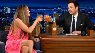 Jennifer Lopez has a toast with Jimmy Fallon