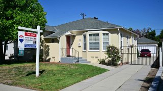 A For Sale sign is posted in front of a home for sale in San Marino, California on September 6, 2023.