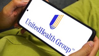 In this photo illustration the UnitedHealth Group logo displayed on a smartphone screen. 