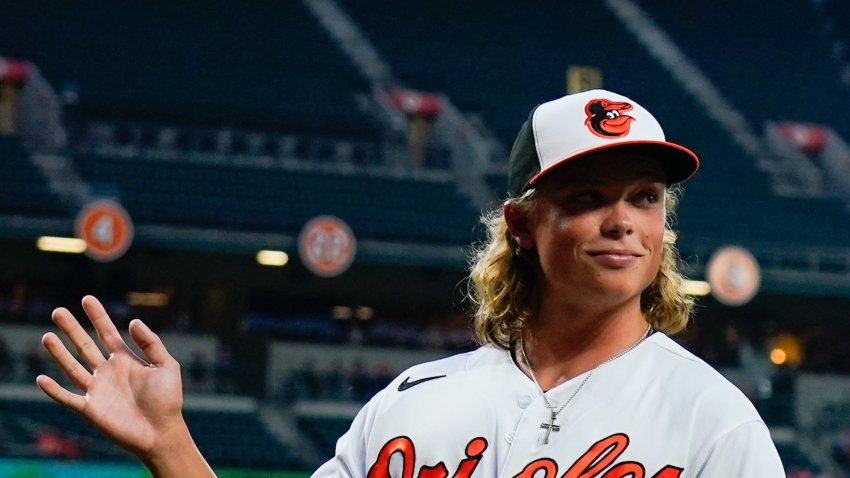 Baltimore Orioles infielder Jackson Holliday waves to the crowd