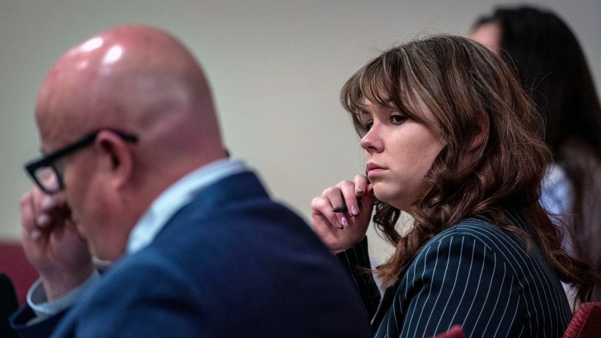 File. Hannah Gutierrez-Reed, center, sits with her attorney Jason Bowles, left, during testimony in the trial against her in First District Court, in Santa Fe, N.M., Friday, March, 1, 2024.  Gutierrez-Reed was working as the armorer on the movie “Rust” when actor Alec Baldwin fatally shot cinematographer Halyna Hutchins and wounded Souza. Gutierrez-Reed is fighting involuntary manslaughter and tampering with evidence charges.