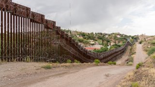 The US/Mexico border fence in Nogales, Arizona USA
