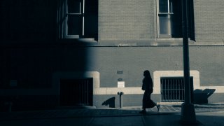 Woman Walking Down the Street in SoHo