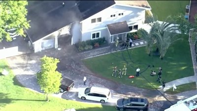 Fire investigation underway in Cooper City after fire erupts inside garage