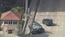 Footage from Chopper 6 shows the two vehicles crushed by a crane piece that fell from a construction site in downtown Fort Lauderdale on Thursday, April 4, 2024.