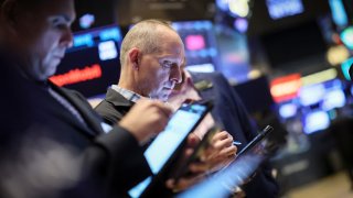 Traders work on the floor at the New York Stock Exchange (NYSE) in New York City, U.S., May 8, 2024.