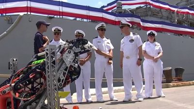 Local robotics team spends day exploring US Navy ship