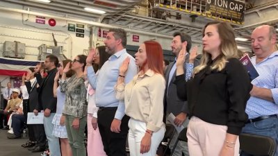 60 people become U.S. citizens at naturalization ceremony on USS Bataan