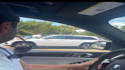 Video shows man on hood of car in North Miami hit-and-run