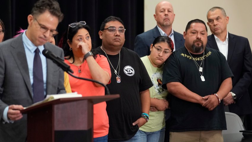 Families of the victims in the Uvalde elementary school shooting listen to attorney Josh Koskoff during a news conference, Wednesday, May 22, 2024, in Uvalde, Texas.