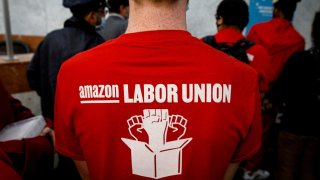Amazon workers arrive with paperwork to unionize at the National Labor Relations Board office in Brooklyn, New York, Oct. 25, 2021.