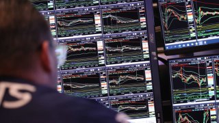 Traders work on the floor of the New York Stock Exchange during afternoon trading on Jan. 17, 2024 in New York City.