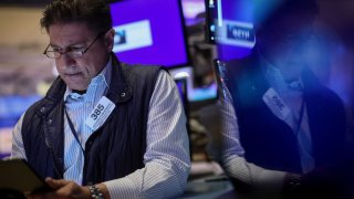 A trader works on the floor at the New York Stock Exchange on March 5, 2024.