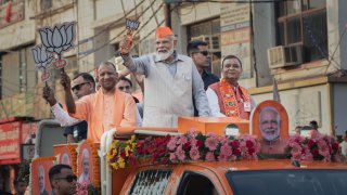 GHAZIABAD INDIA – APRIL 06: Prime Minister Narendra Modi greets supporters at a roadshow on April 06, 2024 in Ghaziabad, Uttar Pradesh, India. India’s 2024 general election is set to be the world’s largest democratic exercise, with over 969 million registered voters, more than the combined population of the EU, US, and Russia. (Photo by Elke Scholiers/Getty Images)