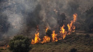 Smoke and flame rise after Hezbollah carried out a missile attack on Safed city, northern Israel on June 12, 2024.