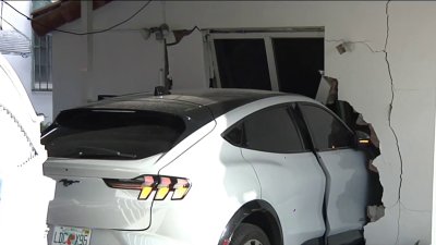 Miami driver crashes SUV through gate and into home