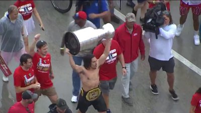 Ryan Lomberg hoists Stanley Cup in the air at Panthers victory parade