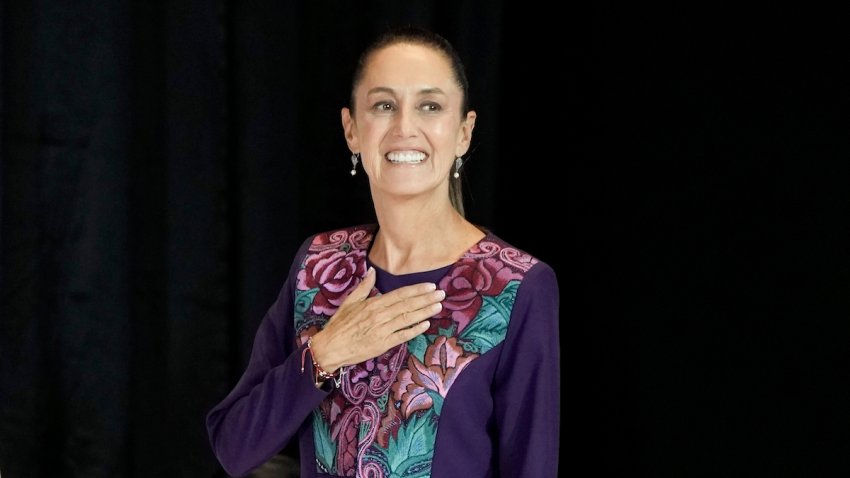 Ruling party presidential candidate Claudia Sheinbaum greets supporters after the National Electoral Institute announced she held an irreversible lead in the election in Mexico City, early Monday, June 3, 2024.