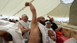 Muslim pilgrims cast stones at pillars in the symbolic stoning of the devil, the last rite of the annual hajj, in Mina, near the holy city of Mecca, Saudi Arabia, Sunday, June 16, 2024. Masses of pilgrims on Sunday embarked on a symbolic stoning of the devil in Saudi Arabia. The ritual marks the final days of the Hajj, or Islamic pilgrimage, and the start of the Eid al-Adha celebrations for Muslims around the world.